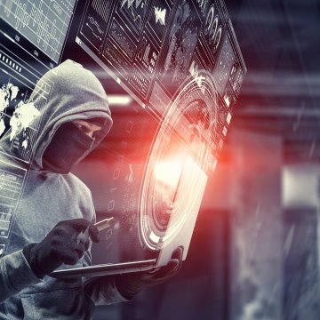 Picture of a hacker attacking the internet